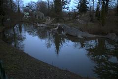 View of Crystal Palace Park with Plesiosaurs and Iguanodons statues