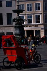 Copenhagen Amagertorv square with historic buildings and people