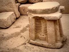 Ancient altar in Hagar Qim temple with hammered columns