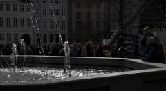 Gammeltorv square in Copenhagen with historic buildings and pedestrians