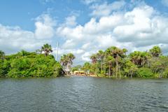 Arial view of Barreirinhas with a river flowing through the town and lush greenery