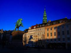 Højbro Plads in Copenhagen with a statue in the center and historic buildings surrounding the square