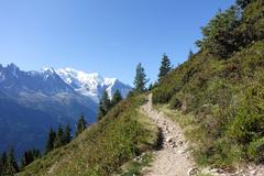 Chemin des Grand Bois trail with scenic mountain and forest views