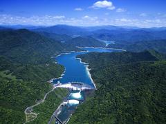 Aerial view of Feitsui Reservoir with dam structure and surrounding catchment area