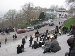 group of tourists watching a street performer