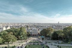 Montmartre Paris street with tourists and historic buildings