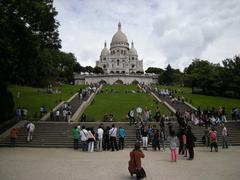 Square Louise-Michel and south facade of the Basilica of the Sacred Heart of Montmartre, Paris