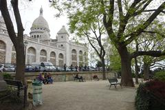 Square Nadar in Montmartre, Paris featuring a statue and a park