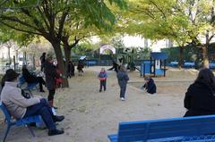 Square Saint-Lambert park with green trees and blue sky