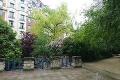 Rain at Square Saint-Lambert in Paris