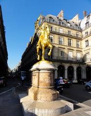 Golden equestrian statue of Jeanne d'Arc