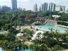 Morning view of Sunway Lagoon with clear blue skies and palm trees