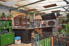 A Bar in Szimpla Kert, with graffiti-covered walls and eclectic decor