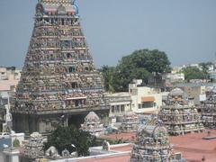 street view of an Indian city with buildings, people, and vehicles