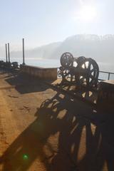 Beautiful dam near Munnar surrounded by lush green hills and a clear blue sky