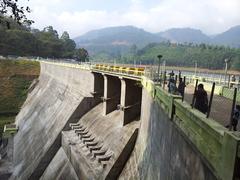 A scenic view of Mattupetty Dam surrounded by lush green hills