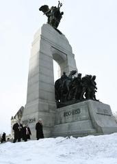 Secretary John Kelly laying flowers on the Tomb of the Unknown Soldier at the National War Memorial in Ottawa