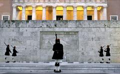 Greek soldiers standing guard at the Tomb of the Unknown Soldier in Athens