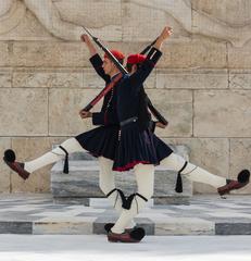 Two Evzones crossing in front of the Tomb of the Unknown Soldier in Athens