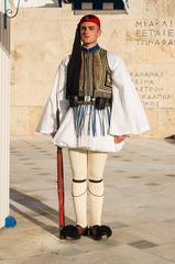 Evzone in ceremonial clothing at the Tomb of the Unknown Soldier in Athens, Greece