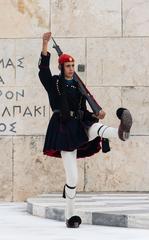 Evzone marching in winter blue clothing at Tomb of the Unknown Soldier in Athens, Greece