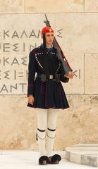 Evzone in winter blue clothing standing guard at the Tomb of the Unknown Soldier in Athens, Greece