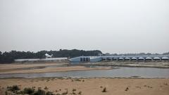 Aerial view of Kallanai Dam with surrounding lush greenery in South Eastern Tamil Nadu