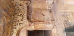 close-up of hand-carved stone in a cave room