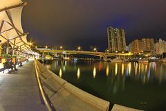 panoramic view of Aberdeen, Hong Kong with residential buildings, boats, and hills in the background