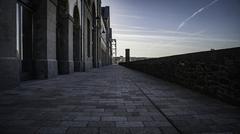 Morning walk on a cobblestone pedestrian walkway