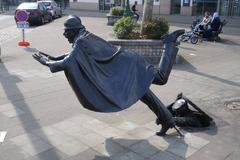 Sculpture of a man tripping a police officer in Brussels