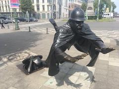 Statue of a policeman grabbed by a man hiding in the sewers in Molenbeek-Saint-Jean