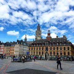 Grand Place in Lille with old exchange building on the right and old buildings on the left