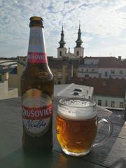 People enjoying drinks on a rooftop cafe in Brno