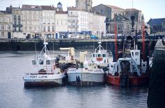 Dredging vessel and barges in Bassin d'Échouage, La Rochelle