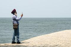 man taking panorama in Fort Kochi, India