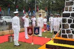 Commodore VZ Job laying a wreath at War Memorial, St Francis Church, Fort Kochi