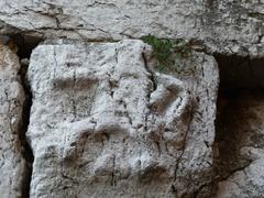 Ancient bas-relief on the megalithic walls near Porta Bellona.