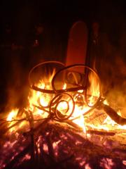 burning chair in flames at night