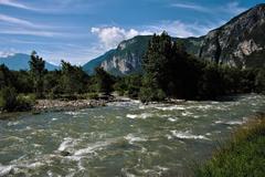 river Avisio flowing through a mountainous landscape