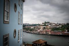 aerial view of Porto with the Dom Luís I Bridge crossing the Douro River and colorful buildings along the riverside