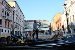 a picturesque view of Venice canals with gondolas and historic architecture