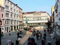 Campo Manin in Venice with historic buildings and statue