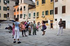 Children jumping rope in a Venice street