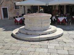 historic stone well in San Stefano with architectural details