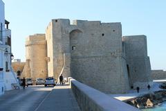 Monopoli, Puglia coastline with historic buildings and clear blue sea