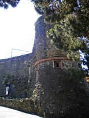 Riomaggiore Castle on a hill with a view of the surrounding village