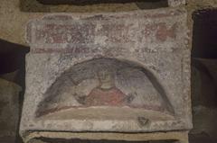 Catacombs of Saint Gennaro, ancient underground burial site with frescoes and arched ceilings