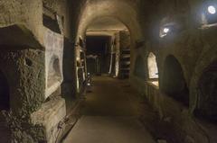 Catacombs of Saint Gennaro entrance with ancient frescoes and stone arches