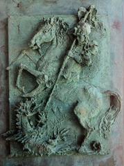 Bronze sculpture on the doors of San Giorgio in Portofino depicting St George and the Dragon